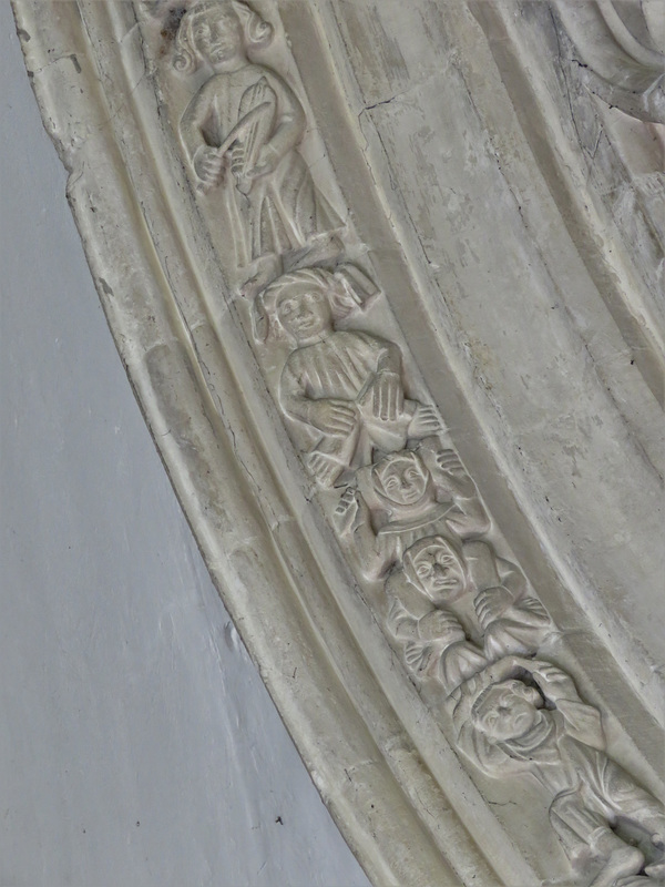 lawford church, essex , lively acrobats and musicians on window moulding around a c14 chancel window