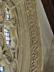 lawford church, essex , lively acrobats and musicians on window moulding around a c14 chancel window