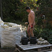 nudist working outdoor nude