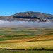 Castelluccio di Norcia spunta dalla nebbia