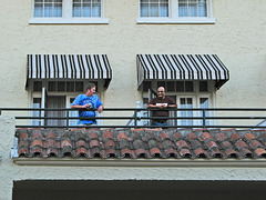 Smiles from balcony to balcony