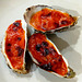 Oysters gratinated with mayonnaise, tomato paste and cheddar