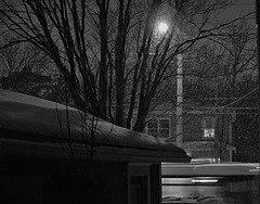 Snowy evening with bus passing