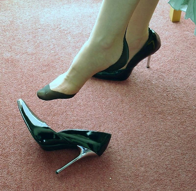 Paul's wife has dropped her high heeled shoe.....