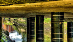 Pillars and Reflections Under The Bridge