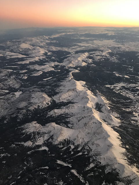 flying over the Rockies, sundown