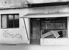chetnik on boarded shopfront