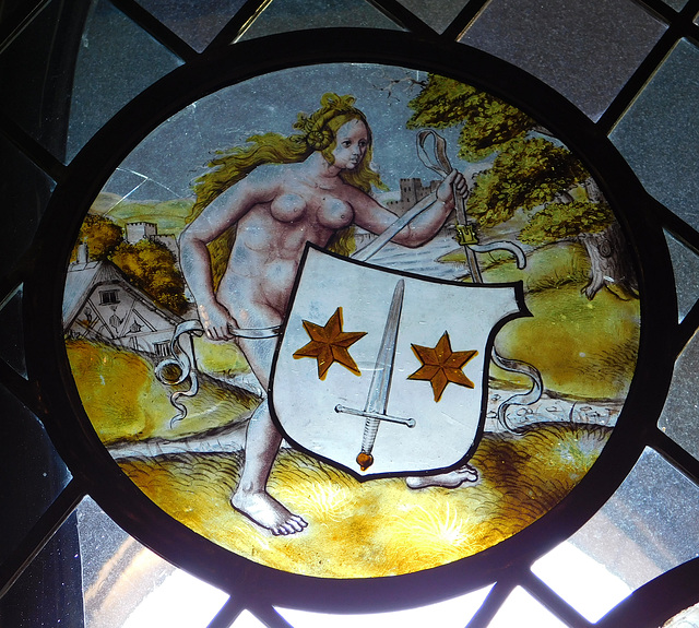 Nude Woman Supporting a Heraldic Shield Stained Glass Roundel in the Cloisters, October 2017