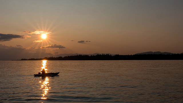 Kayaker in Sunset Beam