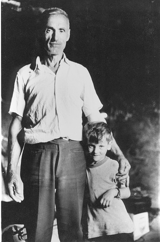 man and boy in black room