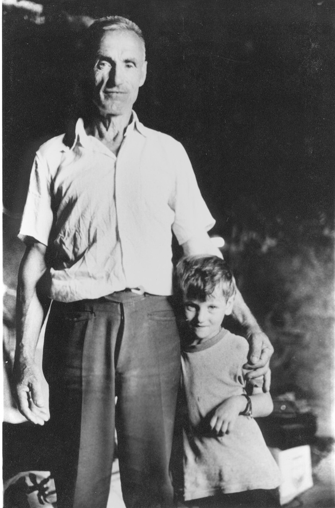 man and boy in black room