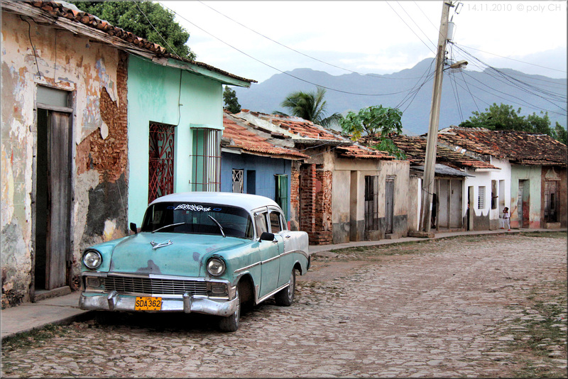 the turquoise green car