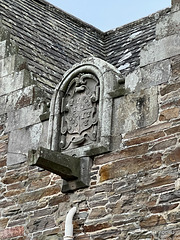 Stone water spout and family crest on the rear of the Altyre Stables