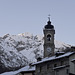 The bell tower of the Church of St. Michael and the last sun on the top of mount - Piedicavallo