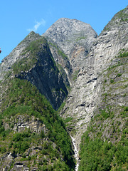 Steep Cliffs Rise Up From Geiranger Fjord