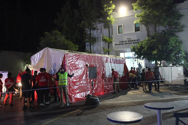 Treating the injured in the car park of the hospital