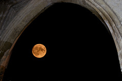 The walls of the church frame the full moon!