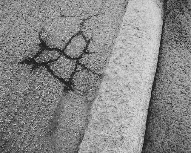 23SH Sidewalk /pavement crack