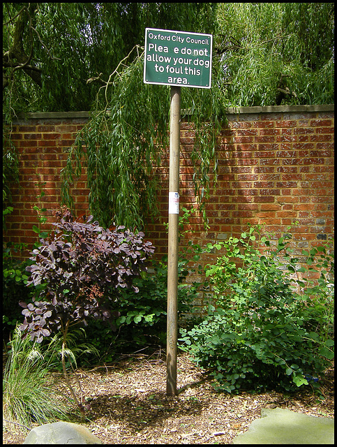 old green dog fouling sign