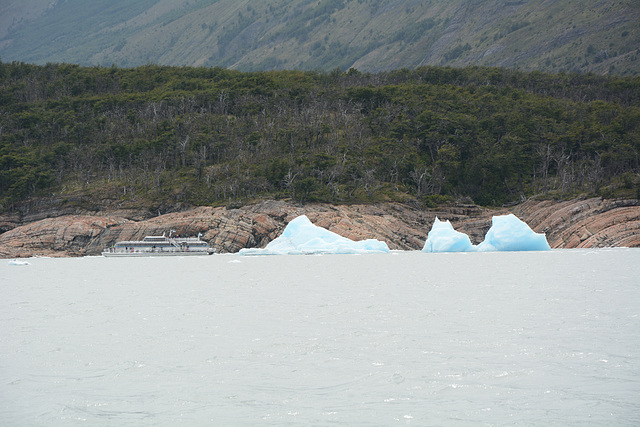 Icebergs and Pleasure Boat on the Lake of Argentino