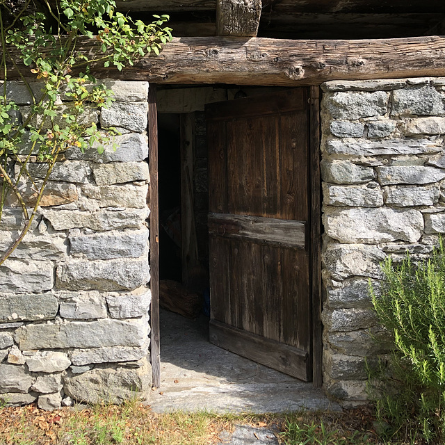 A wall and an open door.