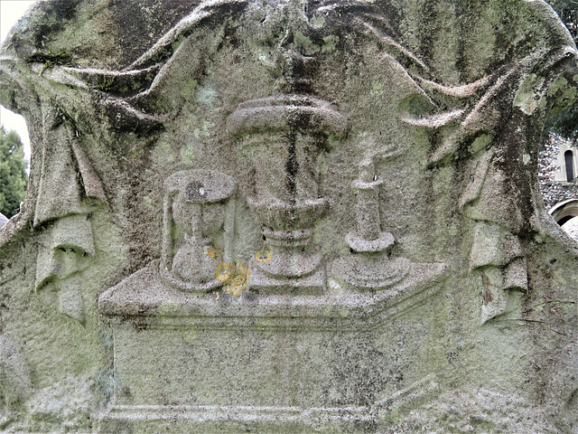 cobham church , surrey (18)c18 gravestone of kerenhappuch jelly +1749 with hourglass, urn and candle blowing in the wind