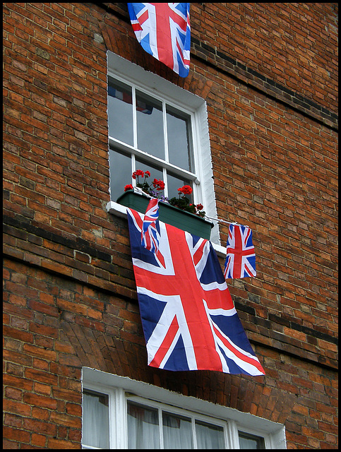 flags out for the Queen