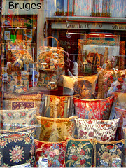 tapestry window display + photographer reflection