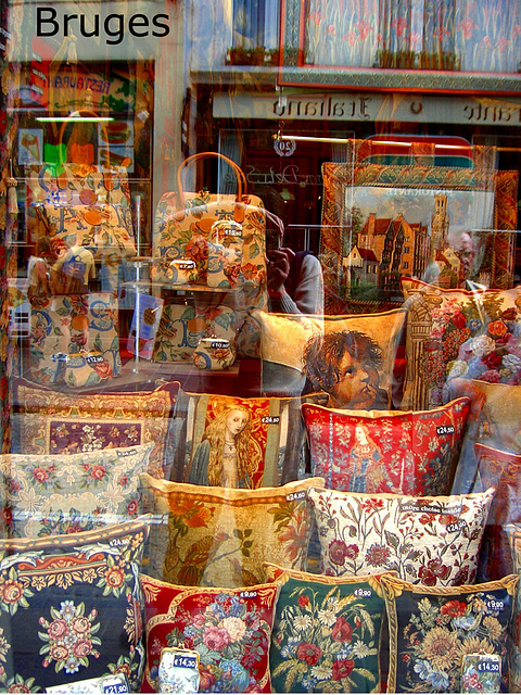 tapestry window display + photographer reflection