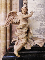 exeter cathedral, devon,angel on c18 tomb of bishop weston +1742 and family by thomas ady