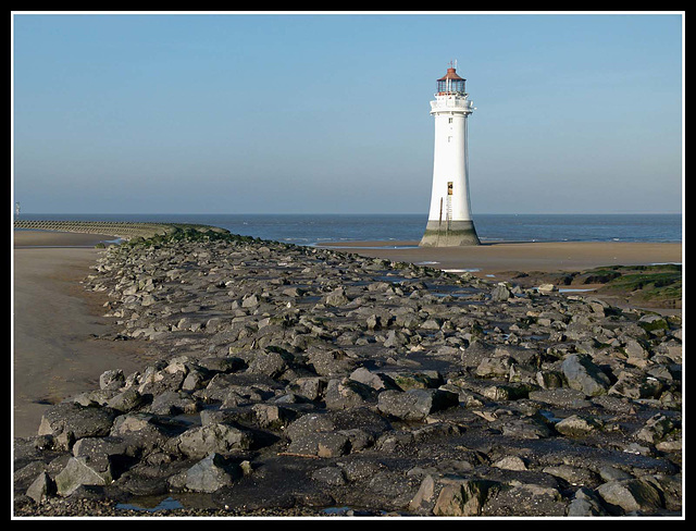 Waterbreak and lighthouse