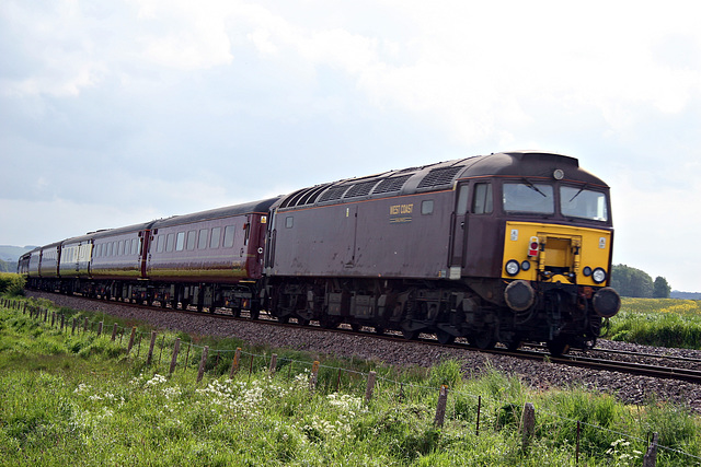 WCRC class 57 57314 on rear of 1Z12 17.12 Scarborough - Dumfries at Willerby Car crossing 30th May 2019.