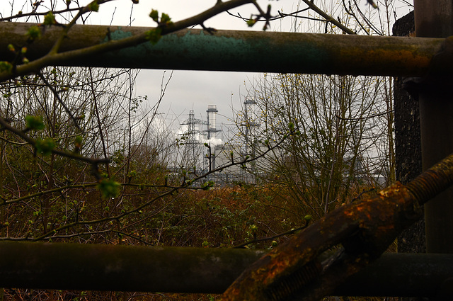 Power station seen through a derelict fence. Power station seen through a derelict fence.