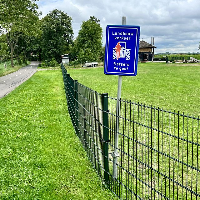 Bad cyclist blocking a tractor