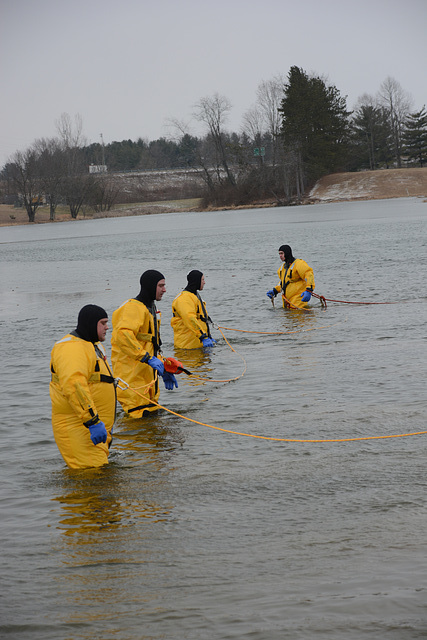 Firemen in cold-water suits in case there's a problem