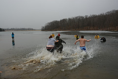 The first group hits the icy water