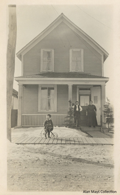 Tim and His Tricycle in Front of the House (Full Photo)