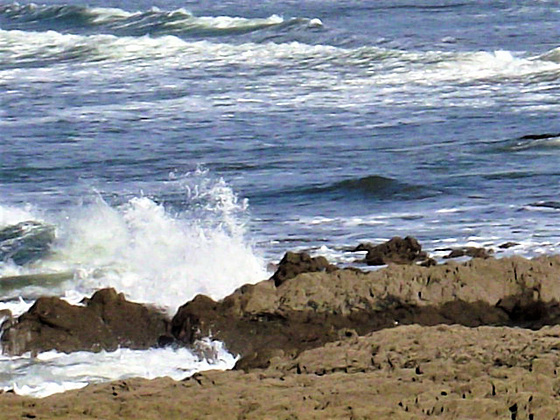Watching the waves break over the rocks