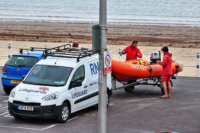 ARANCIA-Class IRB lifeboat, A-25, being put to bed by RNLI lifeguards