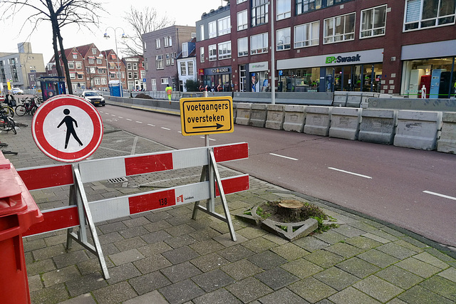 Pedestrians cross the road