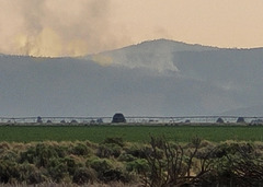 Looking south, fire comes over the mountain