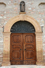 Italy, The Door to the Convent of the Capuchin Friars Minor in Assisi