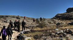 Across the rocks.