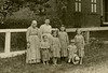 Women and Kids in Front of a House (Cropped)