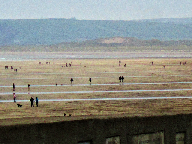 Lots of people taking in the bracing sea air