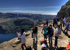 Tourists on the edge of Preikestolen.