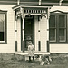 Girl, Dog, and Man in Front of a House (Cropped)