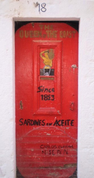 Sardines can painted on door.