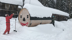 removing the snow from the sauna roof