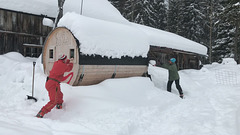 removing the snow from the sauna roof